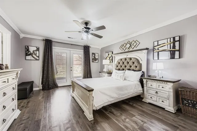 a bedroom with a large bed and a tv