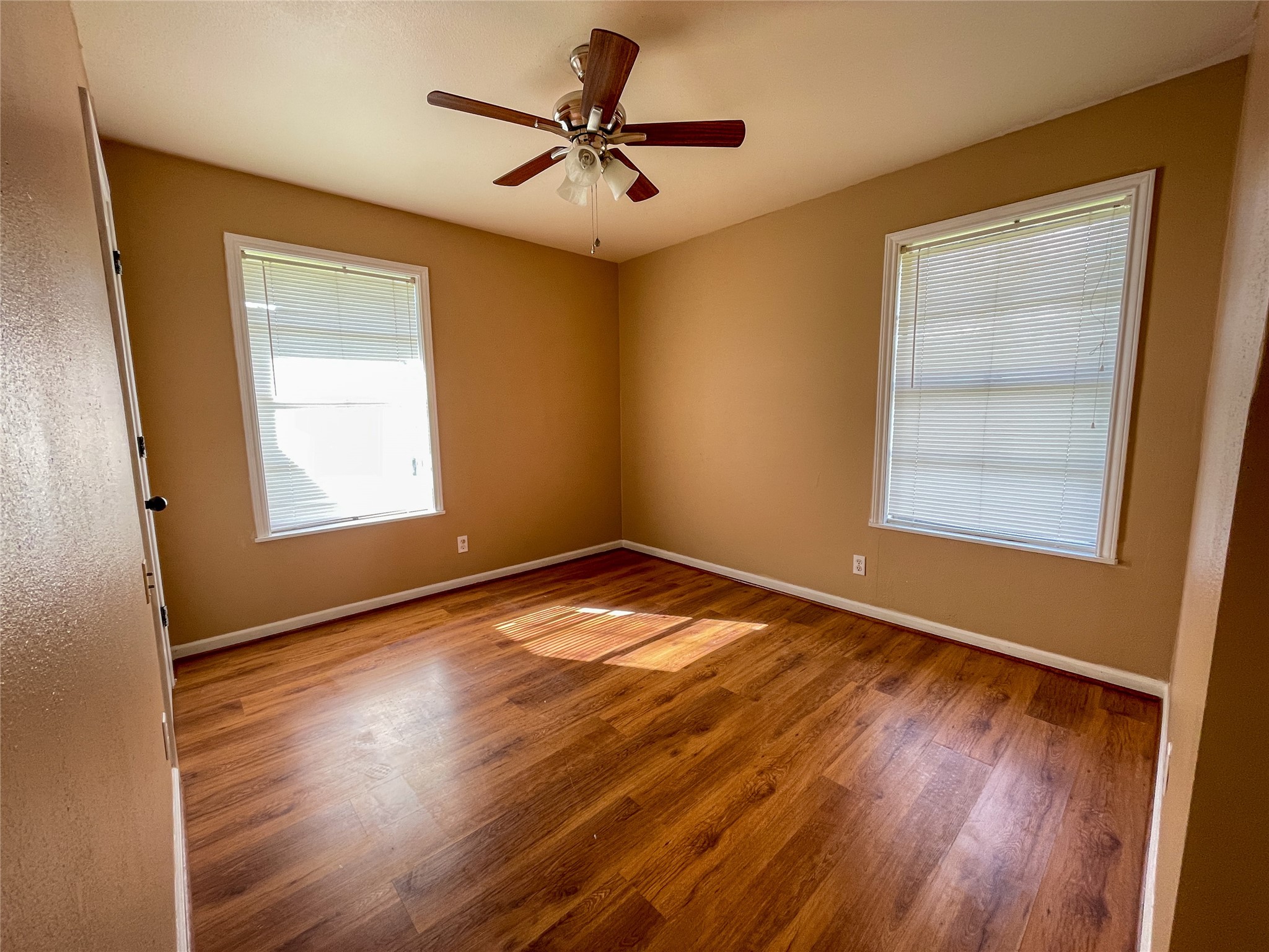 401 Anderson Road Cuero, TX 77954 - Photo 16 of 26 Primary bedroom with laminate flooring
