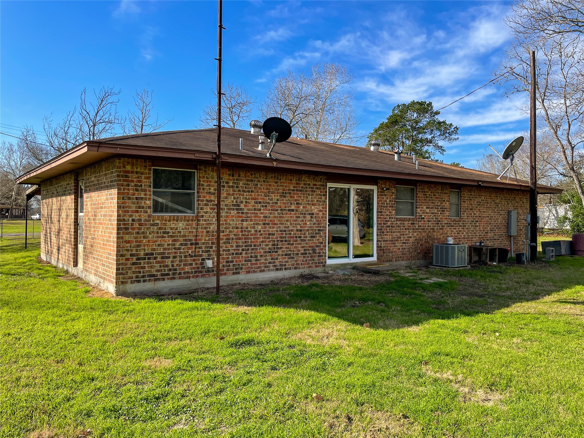 401 Anderson Road Cuero, TX 77954 - Photo 23 of 25 a view of a backyard with potted plants