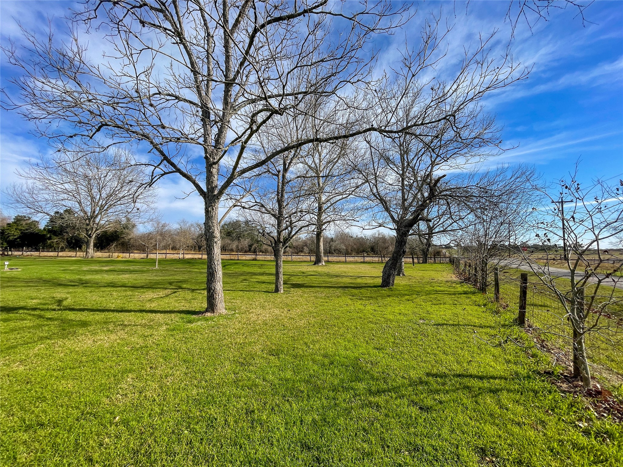 401 Anderson Road Cuero, TX 77954 - Photo 6 of 25 a view of a park with large trees