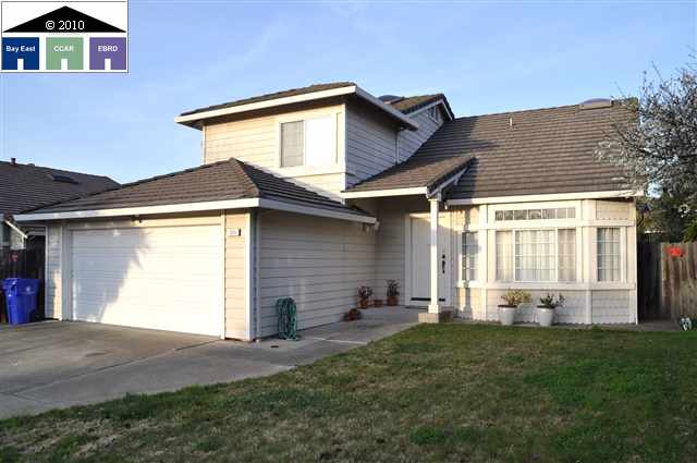 525 Bantry Road Pinole, CA 94564 - Photo 1 of 1 a front view of a house with a yard and garage