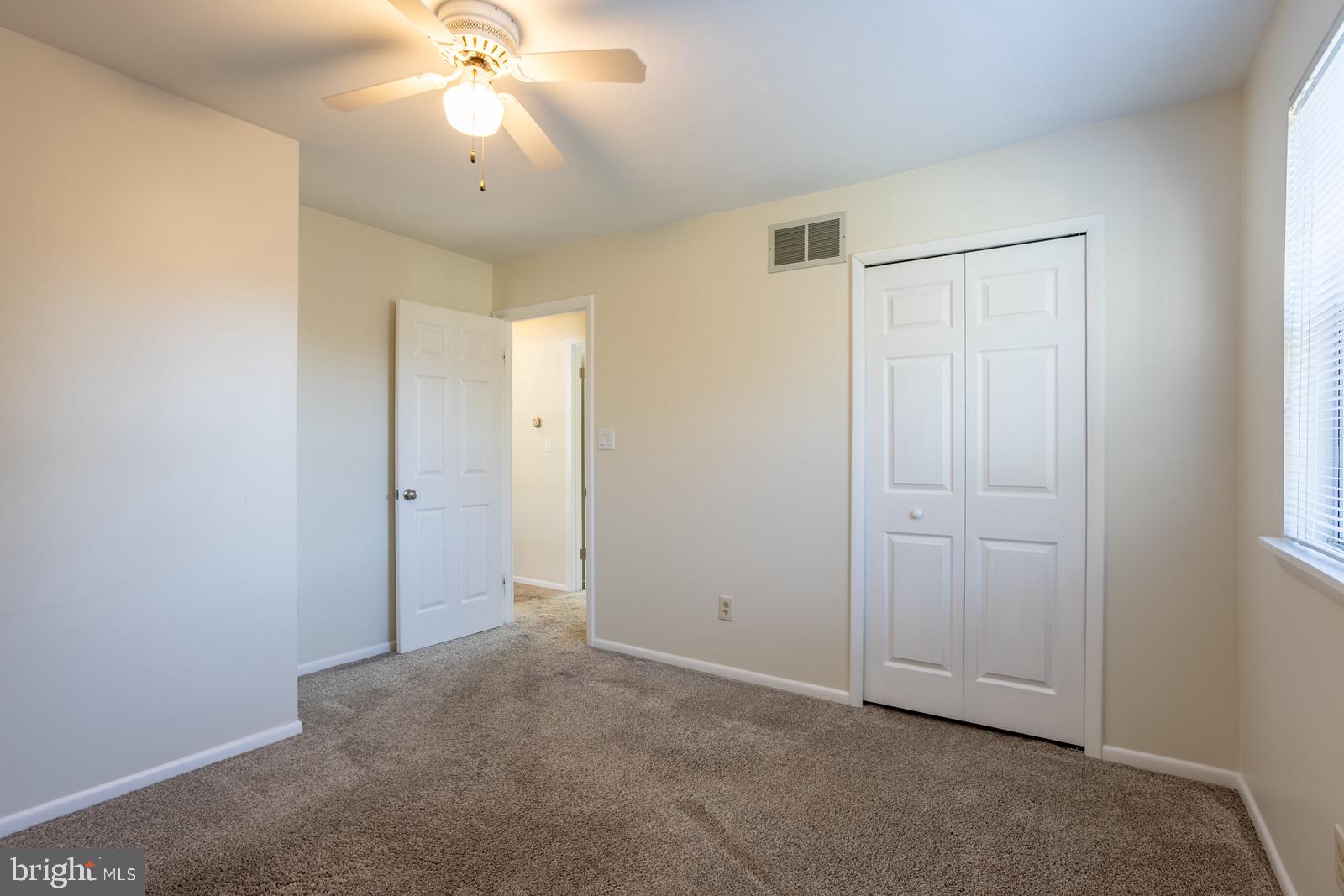 143 Midland Road Glen Burnie, MD 21060 - Photo 24 of 44 a view of an empty room and chandelier fan
