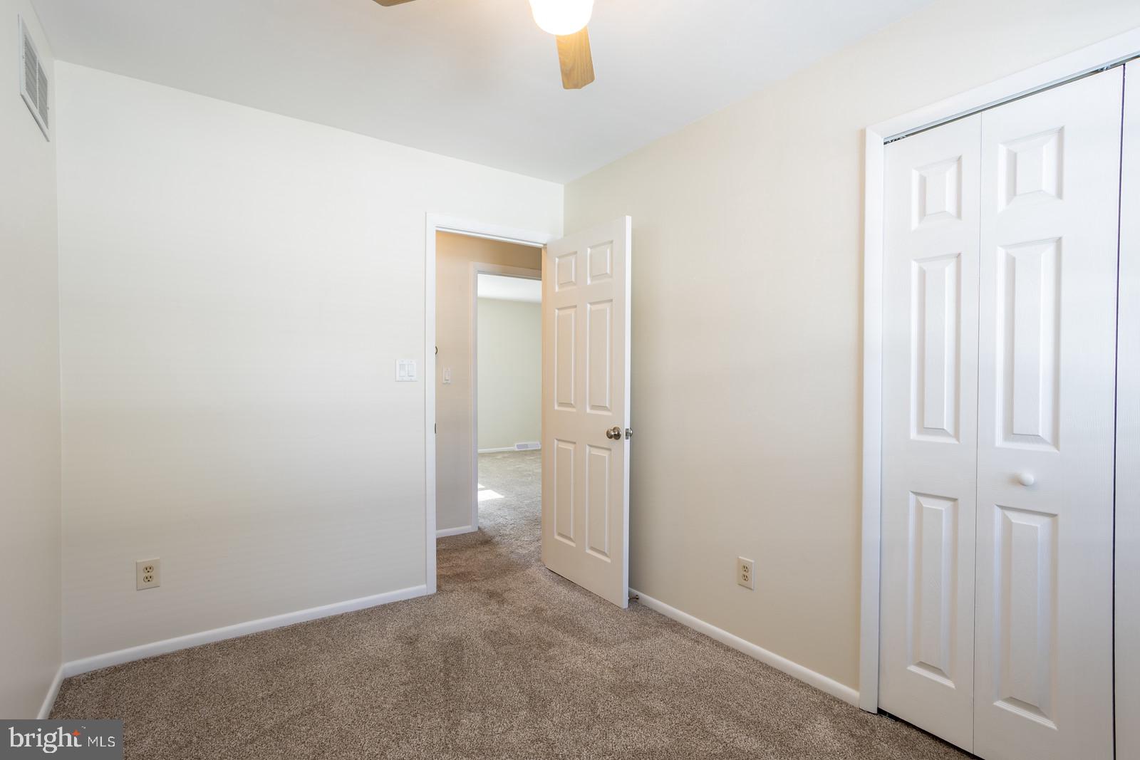 143 Midland Road Glen Burnie, MD 21060 - Photo 25 of 44 an empty room with windows and closet