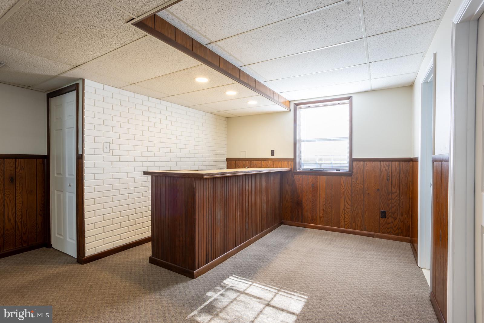143 Midland Road Glen Burnie, MD 21060 - Photo 28 of 44 a view of kitchen with furniture and wooden cabinets