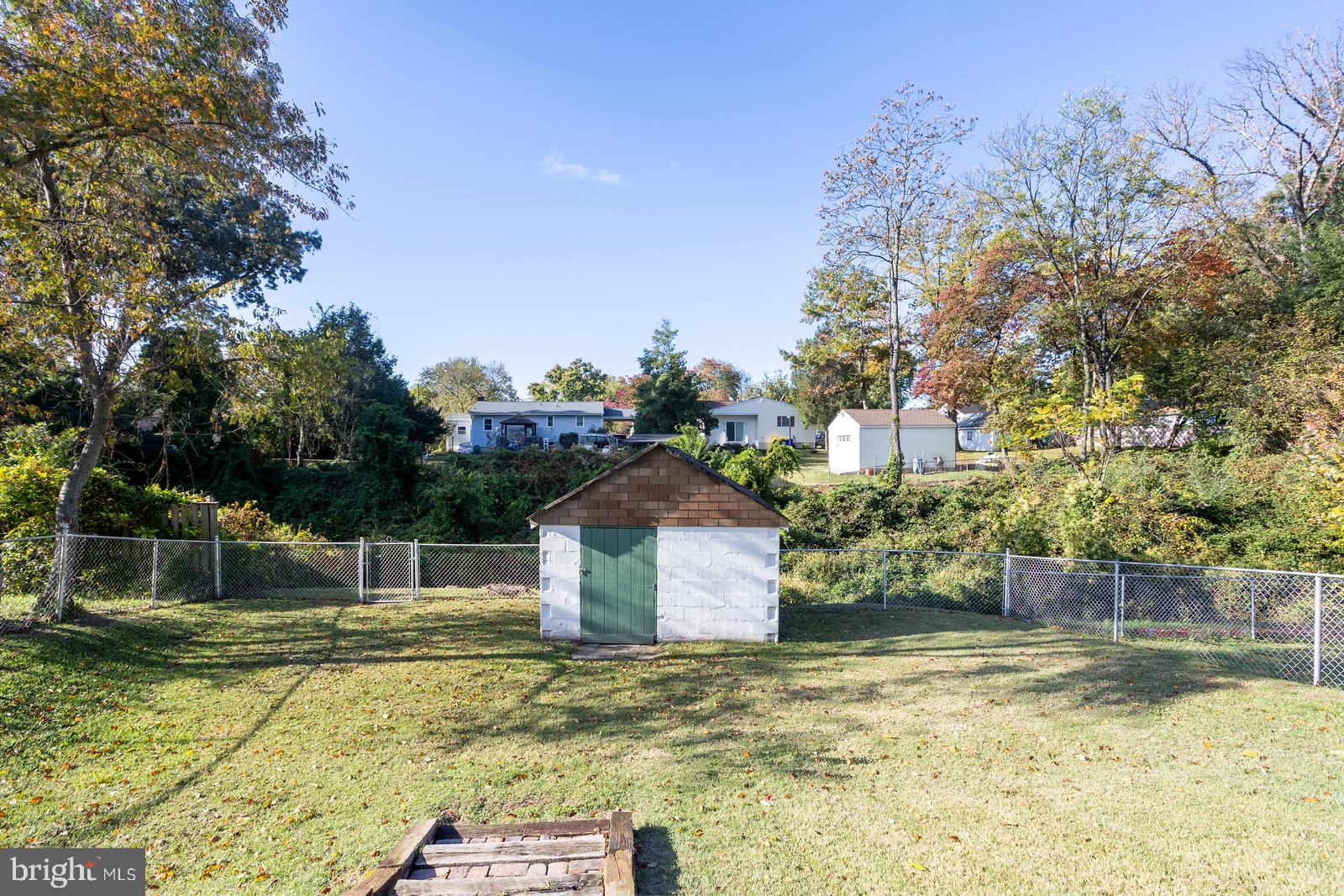 143 Midland Road Glen Burnie, MD 21060 - Photo 44 of 44 a backyard of a house with lots of green space