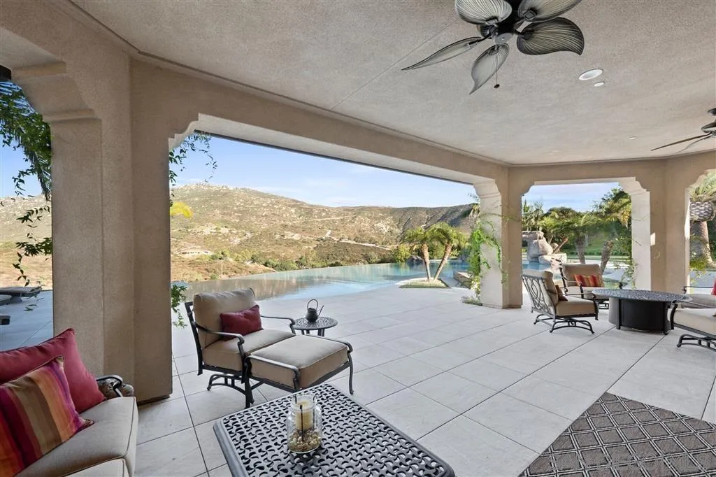 14480 Cheyenne Trail Poway, CA 92064 - Photo 11 of 23 a living room with furniture and a large window
