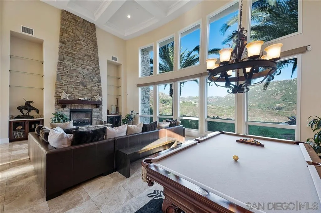 14480 Cheyenne Trail Poway, CA 92064 - Photo 19 of 23 a living room with fireplace furniture and a large window