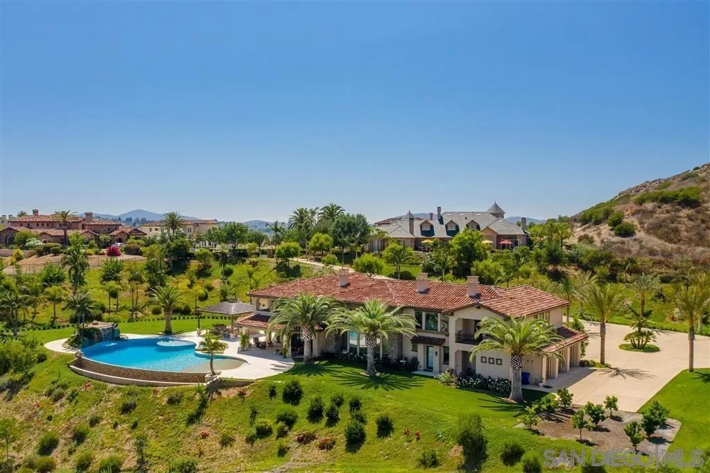 14480 Cheyenne Trail Poway, CA 92064 - Photo 4 of 23 a view of a swimming pool with lawn chairs and plants