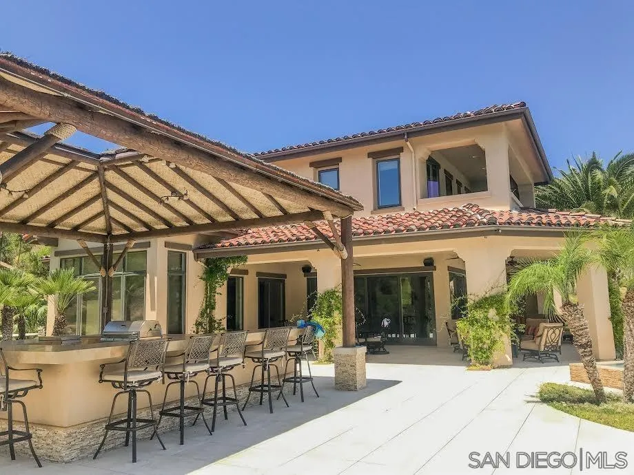 14480 Cheyenne Trail Poway, CA 92064 - Photo 9 of 23 a view of a patio with table and chairs and potted plants