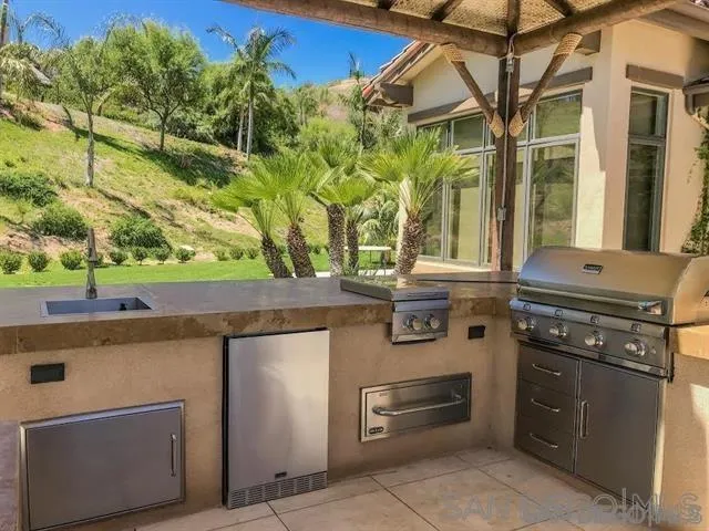 14480 Cheyenne Trail Poway, CA 92064 - Photo 10 of 23 a kitchen with a stove and a microwave
