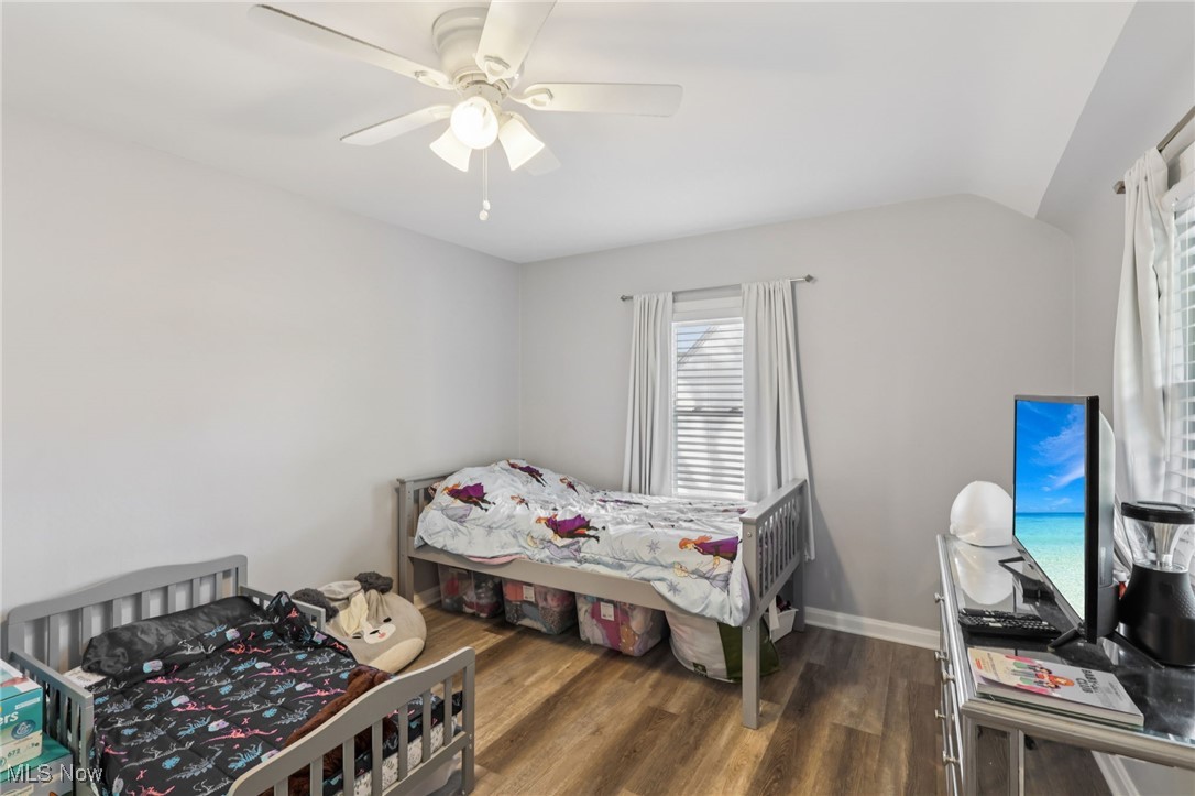 1503 Oakmount Road South Euclid, OH 44121 - Photo 26 of 50 Bedroom featuring dark wood-style floors, a ceiling fan, and lofted ceiling