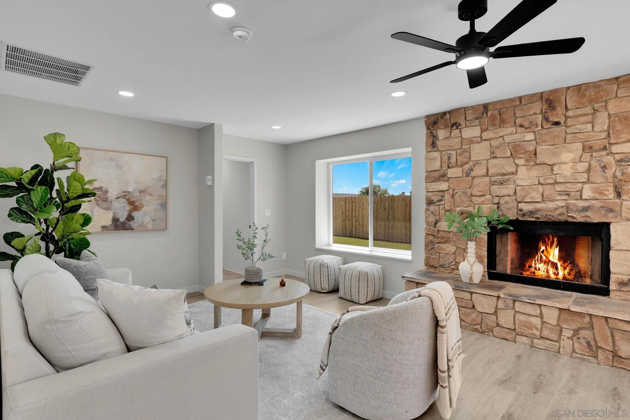 13322 Via Mark Poway, CA 92064 - Photo 7 of 25 a living room with furniture a fireplace and a flat screen tv