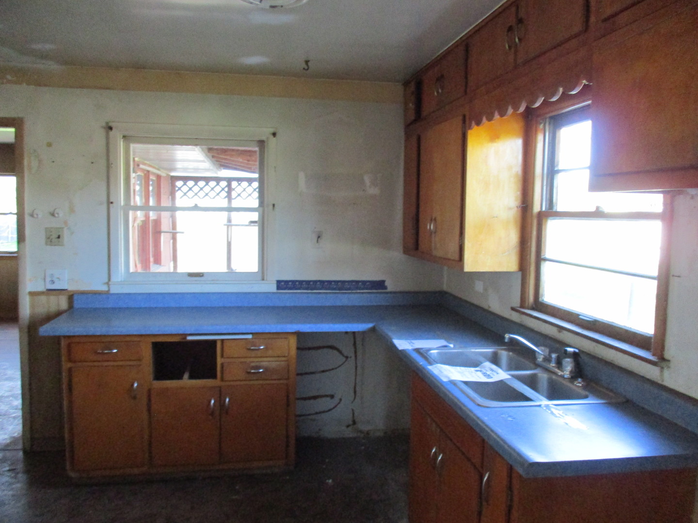 2810 186th Street Lansing, IL 60438 - Photo 12 of 14 a kitchen with a sink cabinets appliances and a window
