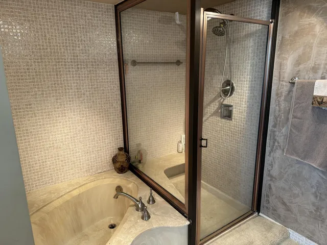 a bedroom with two beds and a couch