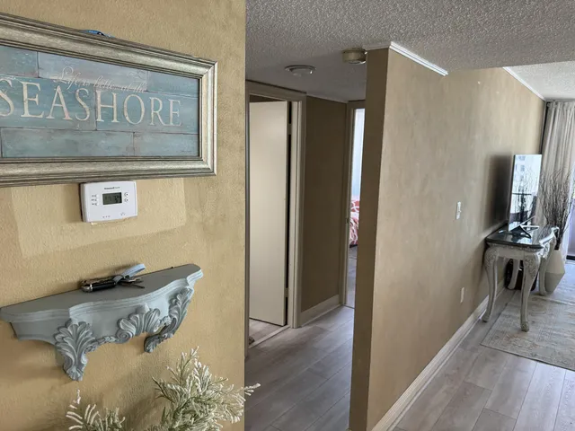 a bathroom with a granite countertop sink toilet and a mirror