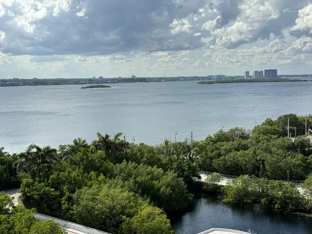 an aerial view of a residential apartment building with a yard