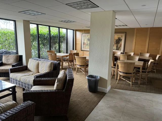 an outdoor space with pool and furniture