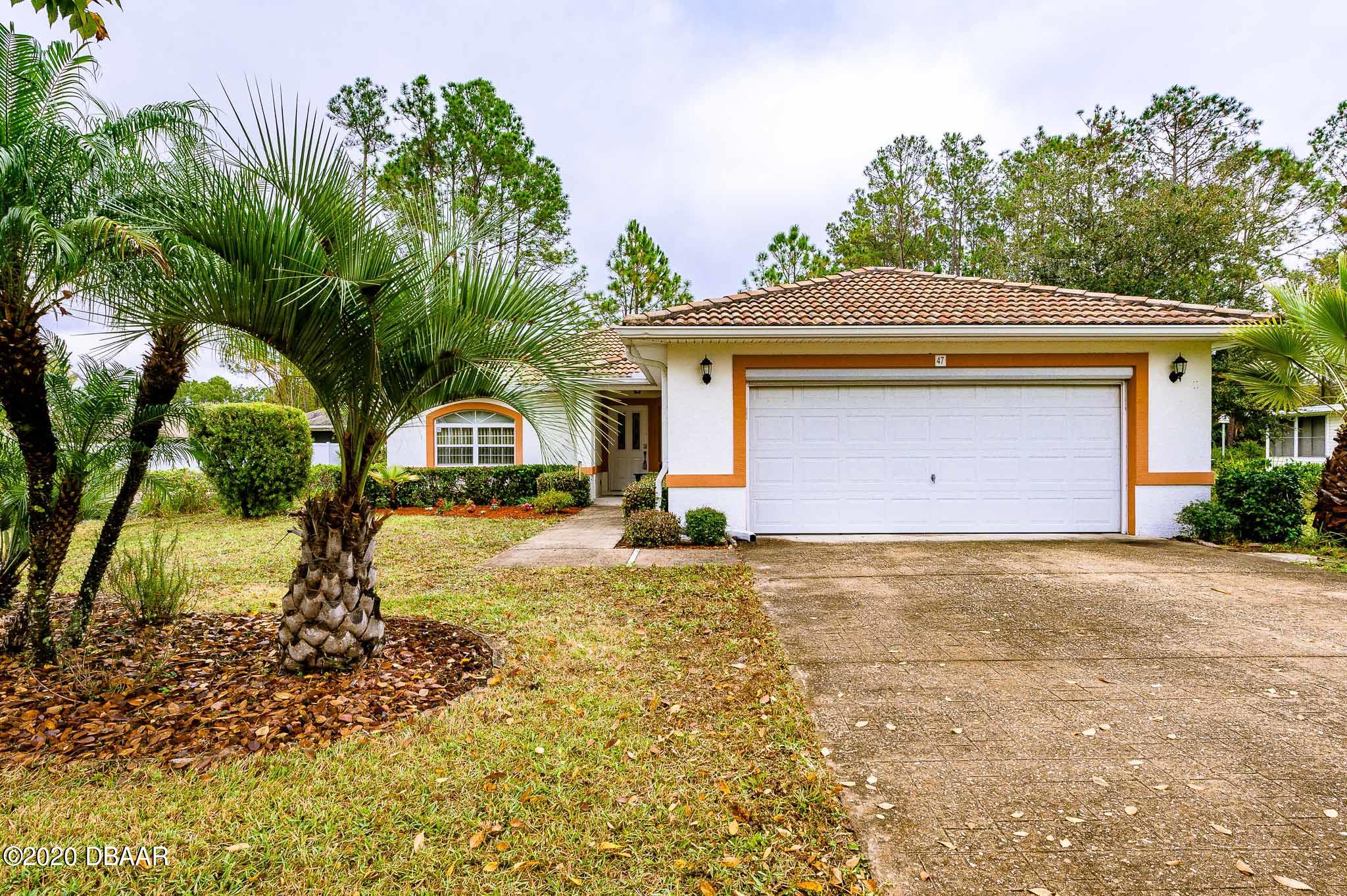 47 Rickenbacker Drive Palm Coast, FL 32164 - Photo 1 of 25 Front
