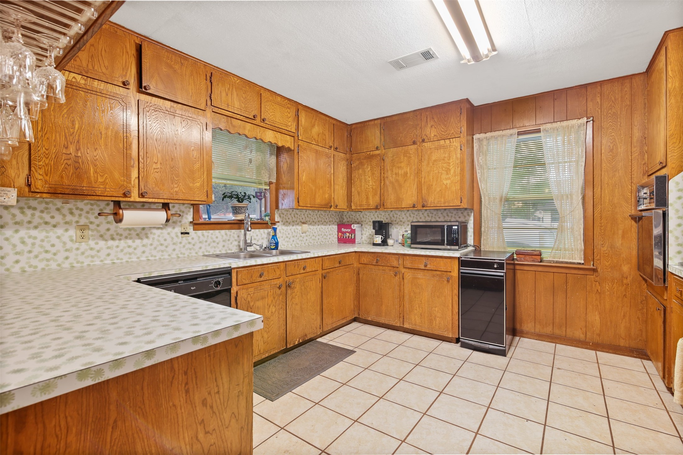 8406 East Mt Houston Road Houston, TX 77050 - Photo 6 of 30 a kitchen with a sink a stove and cabinets
