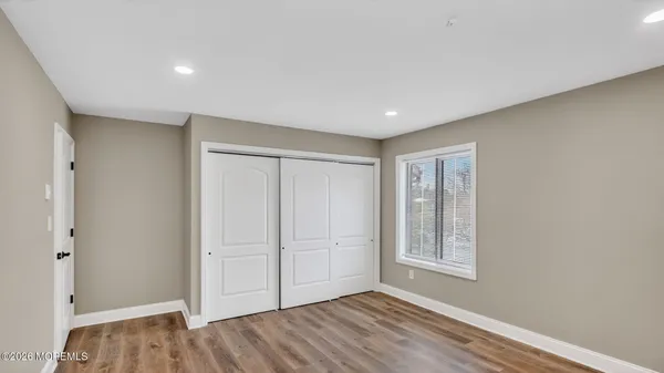 a view of livingroom with hardwood floor and hallway