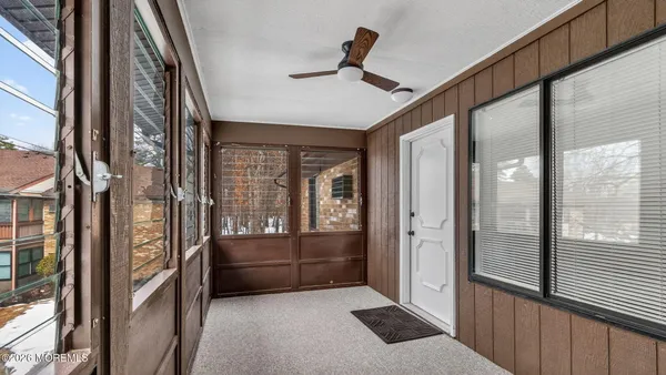 a view of front door and bedroom