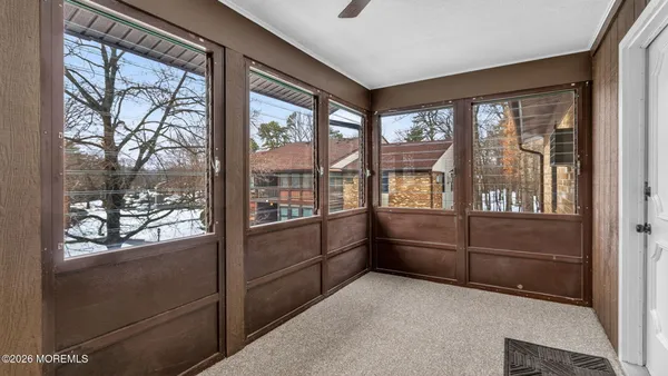 a room with window and furniture
