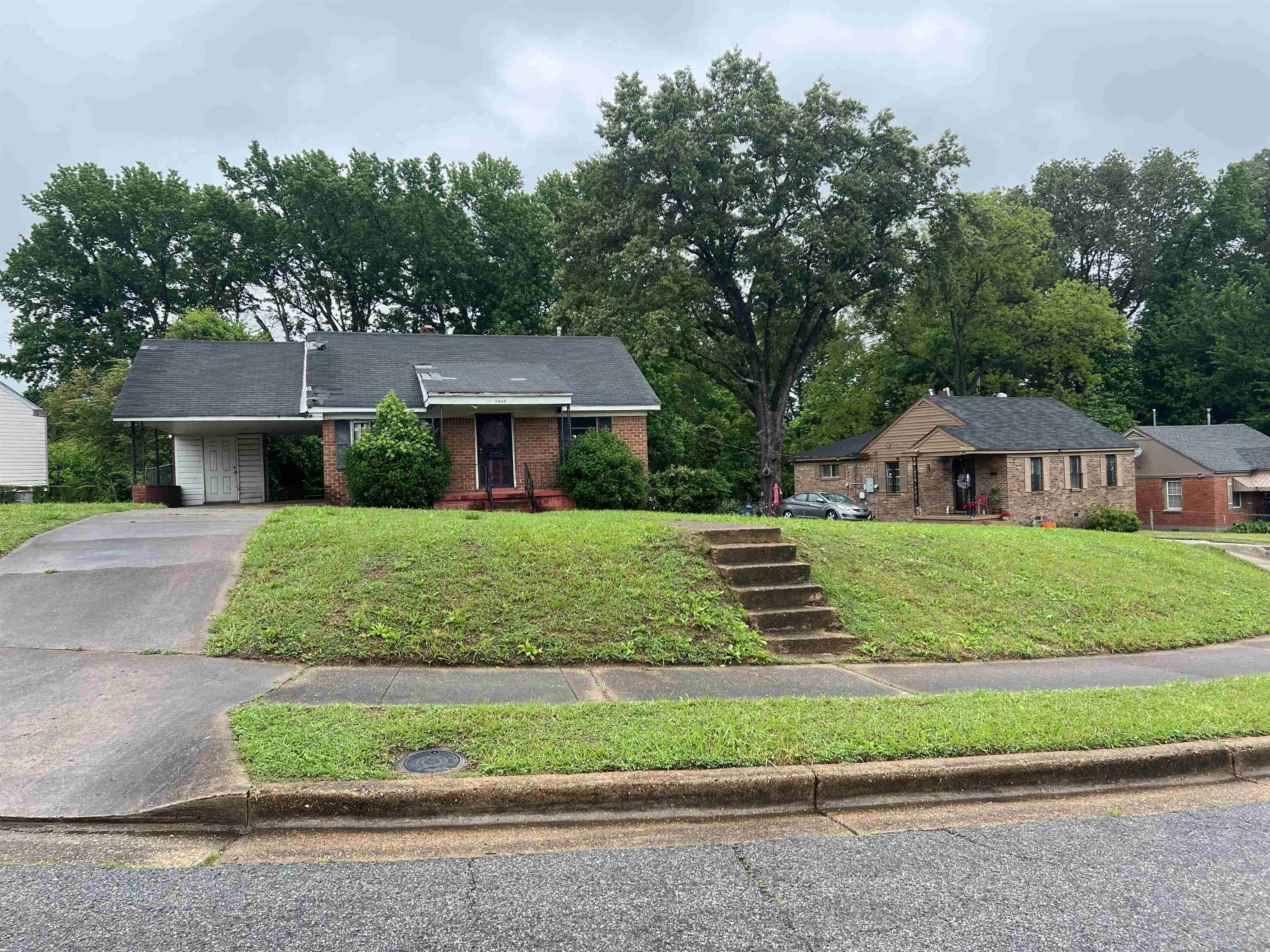 1880 Glory Circle Memphis, TN 38114 - Photo 3 of 3 a front view of a house with a yard