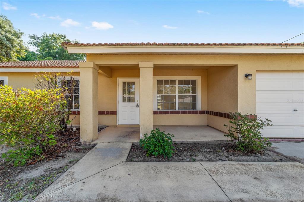 8 Ash Pass Run Ocala, FL 34472 - Photo 2 of 33 a front view of a house with a yard and garage