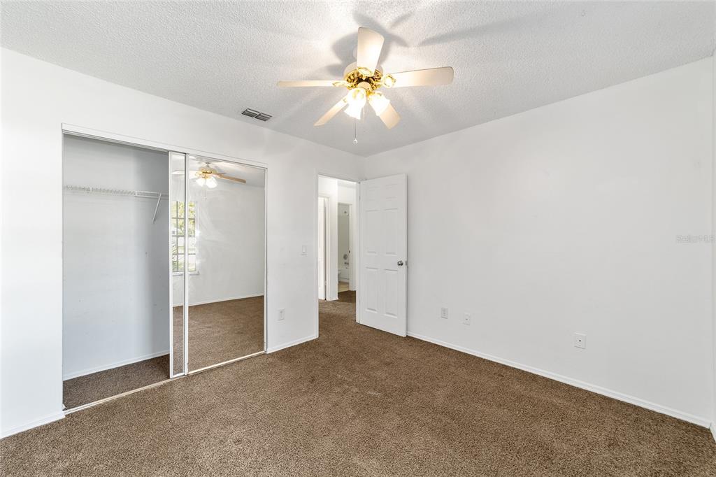8 Ash Pass Run Ocala, FL 34472 - Photo 23 of 33 an empty room with closet and a ceiling fan