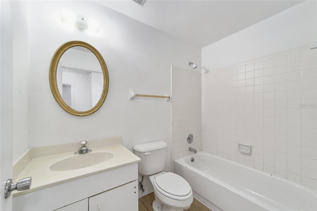 8 Ash Pass Run Ocala, FL 34472 - Photo 24 of 33 a bathroom with a sink a toilet and a mirror