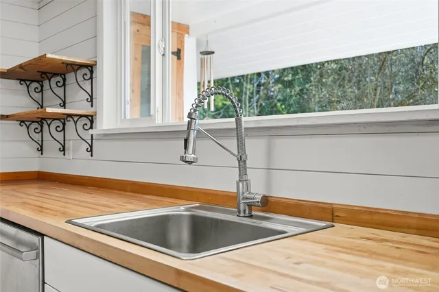 a view of a kitchen with furniture and window