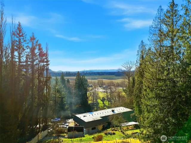 a view of a balcony with chair and table