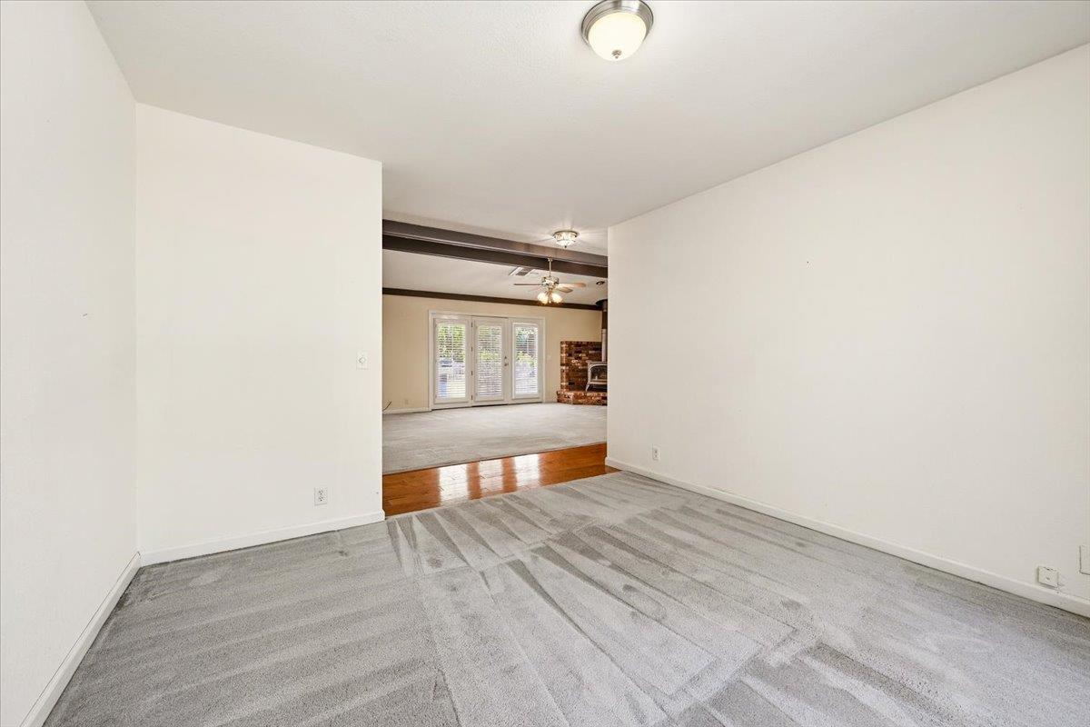12600 Friar Tuck Road Grass Valley, CA 95949 - Photo 8 of 56 a view of an empty room with wooden floor and a window