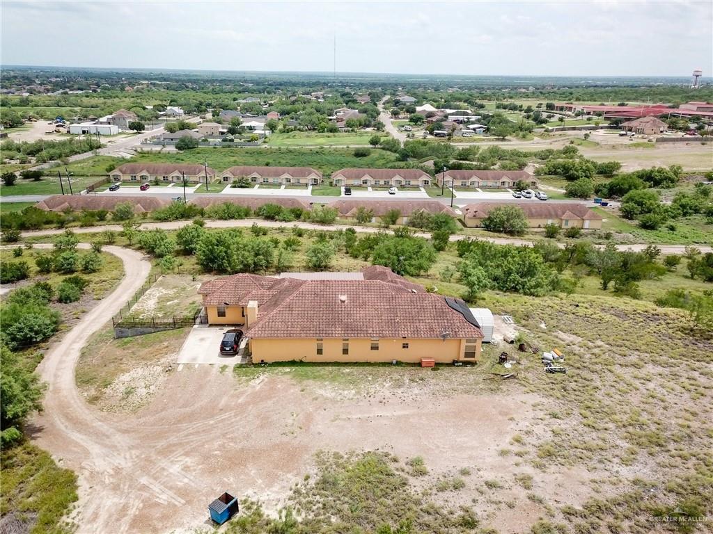 771 North Ebony Avenue Roma, TX 78584 - Photo 9 of 12 an aerial view of a house with a yard
