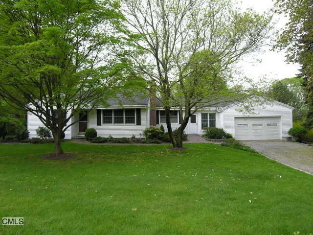 43 Hobby Drive Ridgefield, CT 06877 - Photo 1 of 1 a front view of a house with a garden
