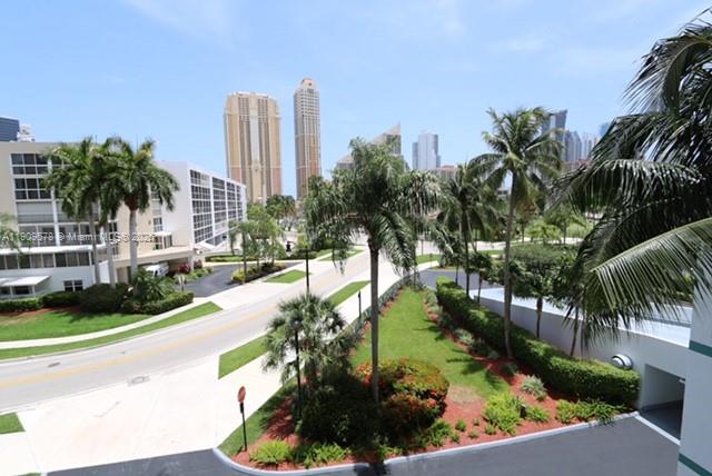 17800 North Bay Road, Unit 404 Sunny Isles Beach, FL 33160 - Photo 24 of 36 a view of a garden with a fountain