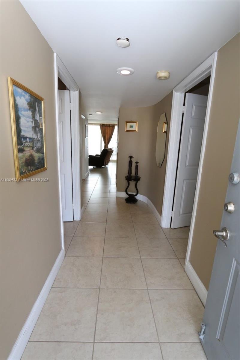 17800 North Bay Road, Unit 404 Sunny Isles Beach, FL 33160 - Photo 27 of 36 a view of a hallway and a livingroom with furniture