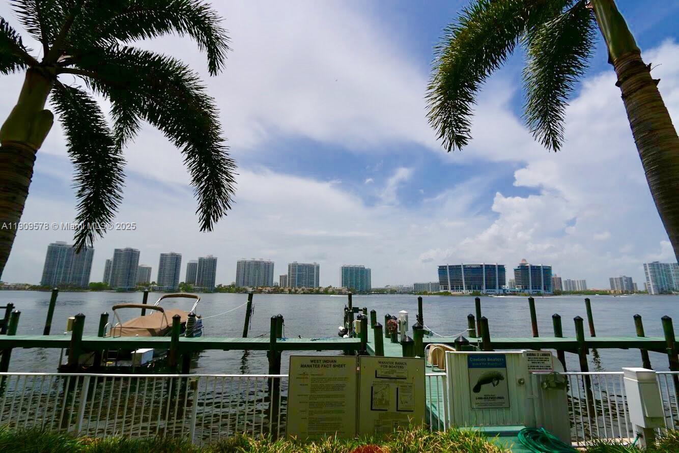 17800 North Bay Road, Unit 404 Sunny Isles Beach, FL 33160 - Photo 33 of 36 a balcony with view of residential houses with outdoor space and lake view