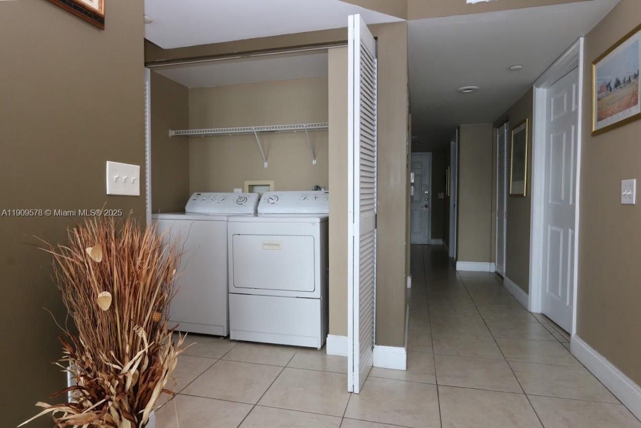 17800 North Bay Road, Unit 404 Sunny Isles Beach, FL 33160 - Photo 10 of 36 a utility room with cabinets