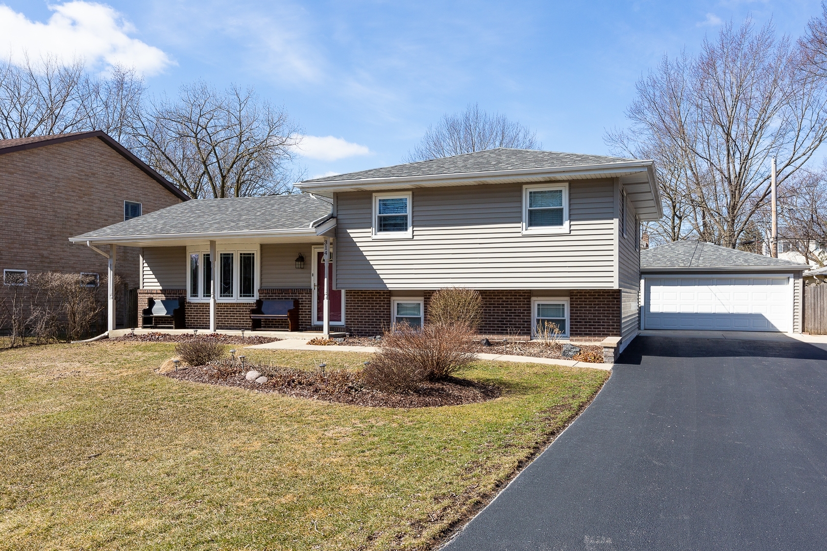 a front view of a house with yard patio and fire pit