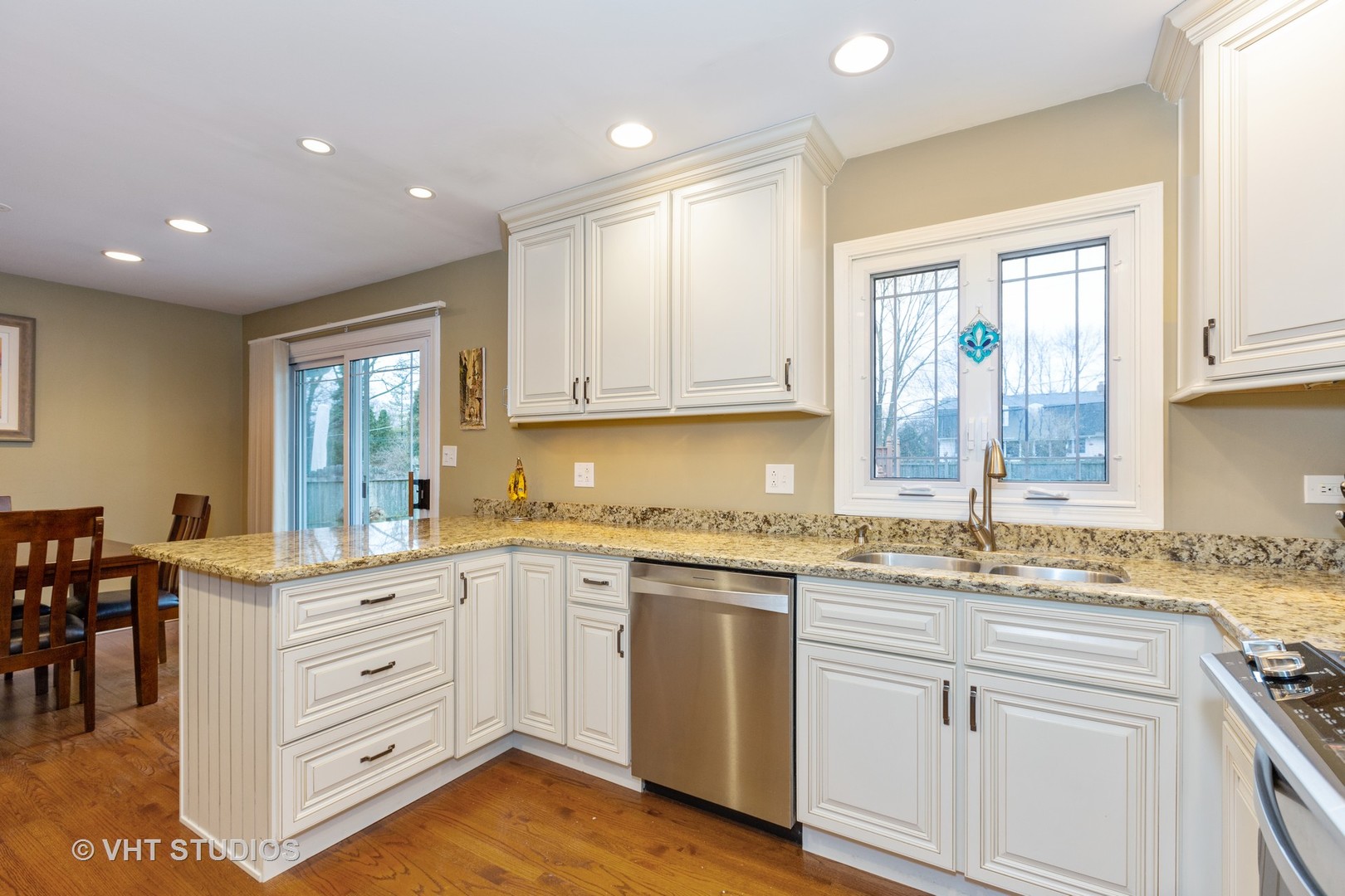 314 Highland Road Willowbrook, IL 60527 - Photo 6 of 15 a kitchen with a sink stove and cabinets