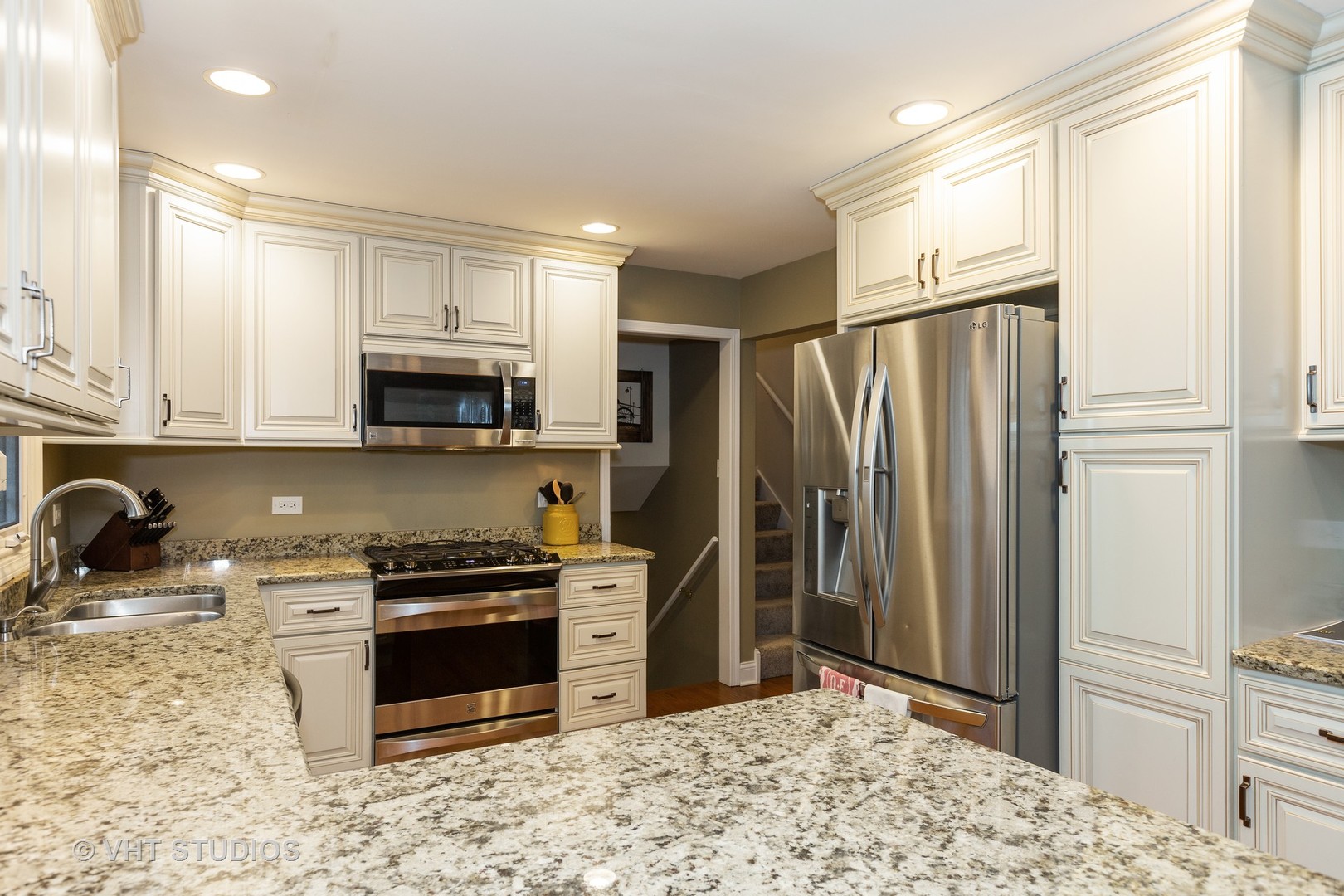 314 Highland Road Willowbrook, IL 60527 - Photo 7 of 15 a kitchen with stainless steel appliances a stove a sink and a refrigerator