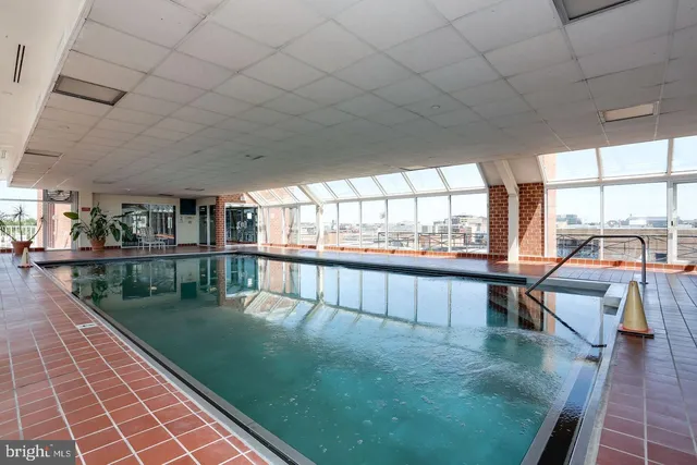 a view of swimming pool with seating area