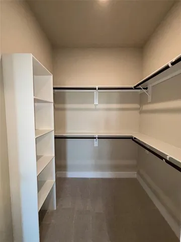 a view of an empty walk in closet
