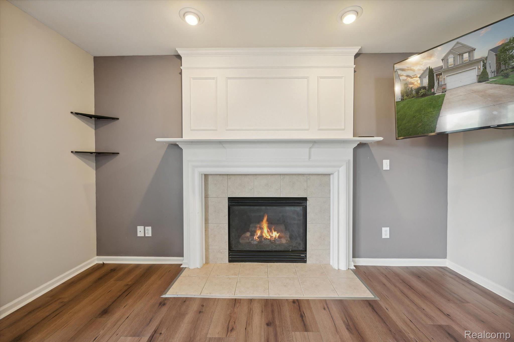 964 Callaway Court Howell, MI 48843 - Photo 15 of 44 Cozy gas fireplace