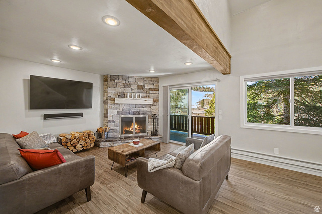 561 Vasels Road, Unit R15C Brian Head, UT 84719 - Photo 1 of 1 Living room with hardwood / wood-style floors, baseboard heating, a stone fireplace, and recessed lighting