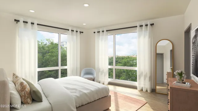 a bedroom with a large bed and a large window