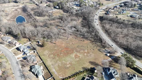 a view of a lake with a car parked on the road