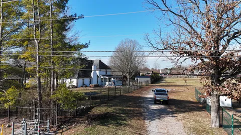 a view of a town with trees in the background