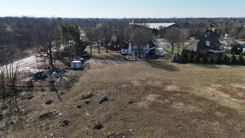 a view of dirt yard with mountain view